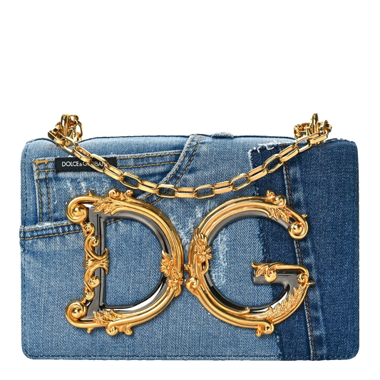 Denim handbag with gold chain and ornate 'DG' logo on a white background